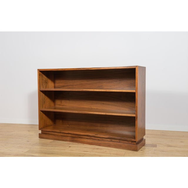 This bookcase was manufactured in Denmark during the 1930s and is designed in the Art Deco style. The piece is...
