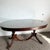 This exquisite Federal-style dining table from the 1940s is crafted from rich flamed mahogany and features a custom...