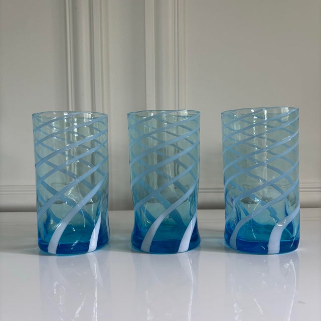 Lovely set of six blue lagoon white swirl design Murano glass tumblers. Very fun whimsical print! Made in Italy. Brand...