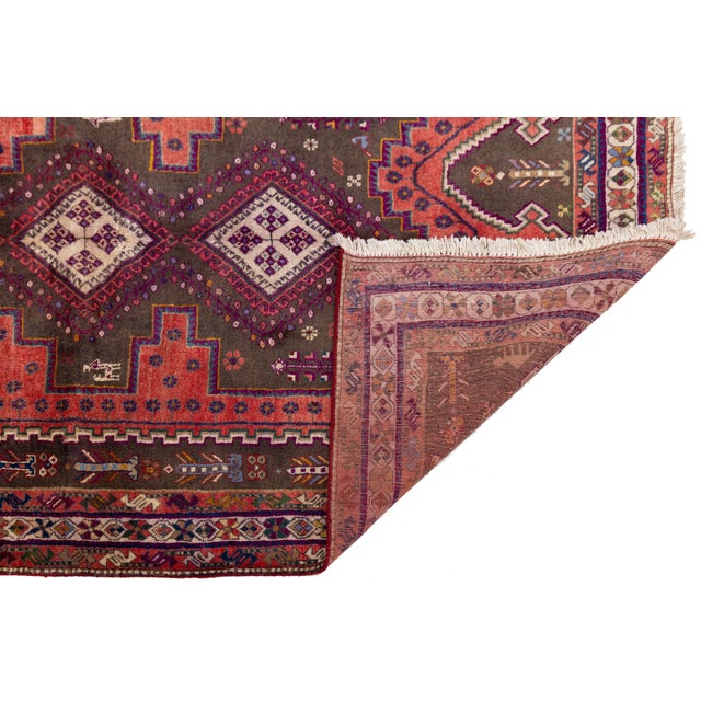 Elevate your space with this exceptional vintage Shiraz rug, hand-woven with premium hand-spun wool. Showcasing the rich...