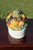 An abundance of fruit adorns this covered serving dish rendered in ceramic by Bordallo Pinheiro. It is marked on the...