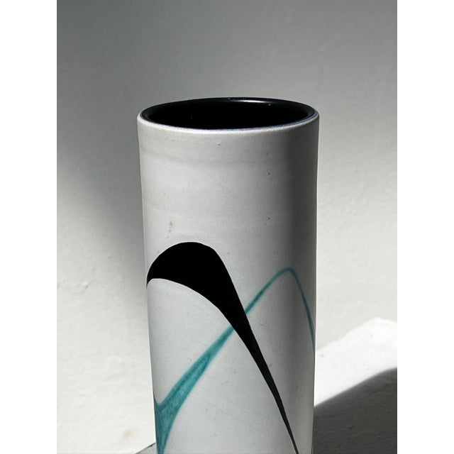 This elegant vintage studio pottery vase, attributed to Müller Lucerne, is a striking example of mid-century modern Swiss...