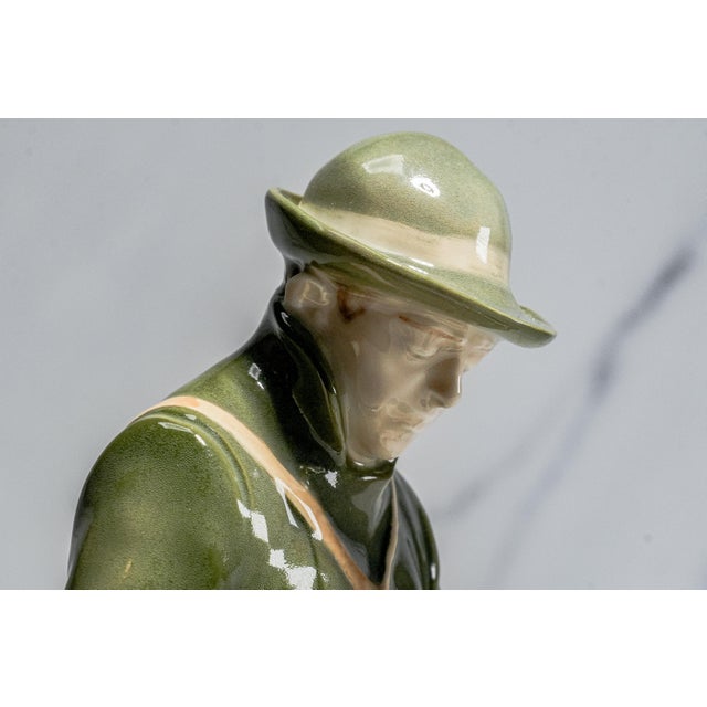 This handsome Royal Copenhagen porcelain figurine #1087, “Hunter with Dog,” is a beautifully modeled example of the...