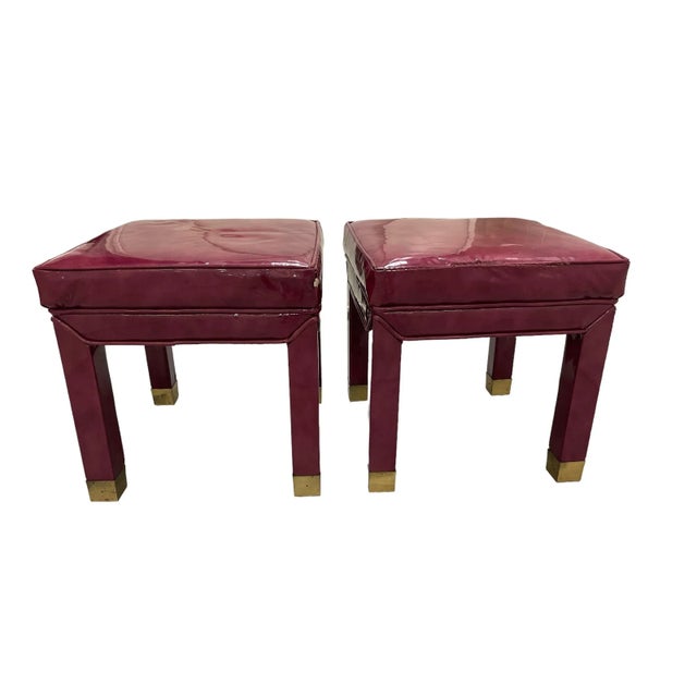 Vintage Milo Baughman style parsons stools. Oxblood red patent leather upholstery with self welt and brass cap feet.