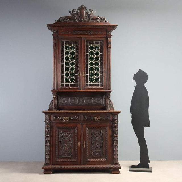 Neo-Renaissance style double-body sideboard crafted from fine walnut, dating to the late 19th century in Italy. The upper...