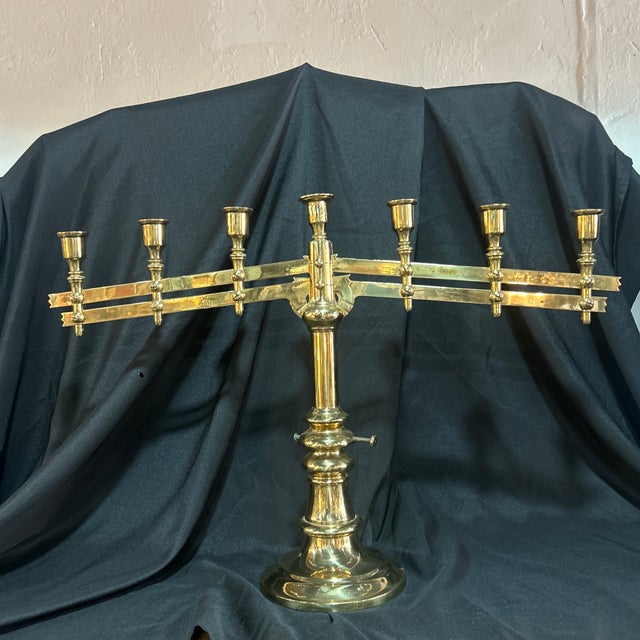 Gorgeous antique menorah or 7 candleholder. Made in the 1800’s. Adjustable fold down or straight across.