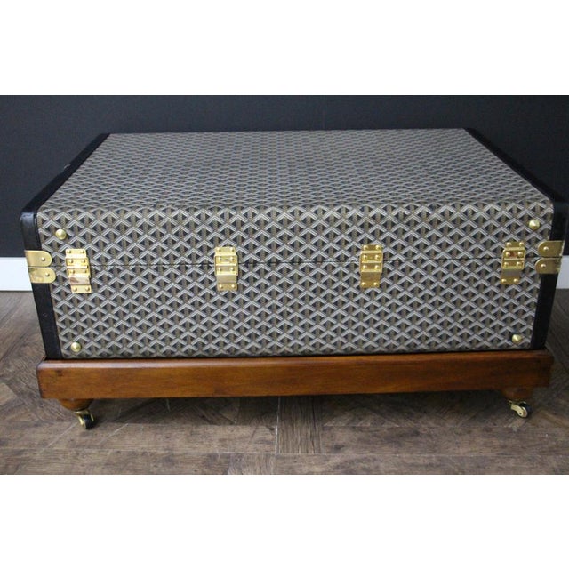 This superb Goyard trunk features the very sought after woven chevrons canvas as well as all solid brass locks and...