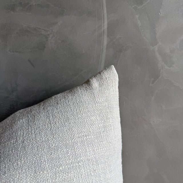 22 x 22 Color: Off White / Light Gray Blue Undertone Belgian Otis linen pillow in Snow — a refined, soft-white accent...