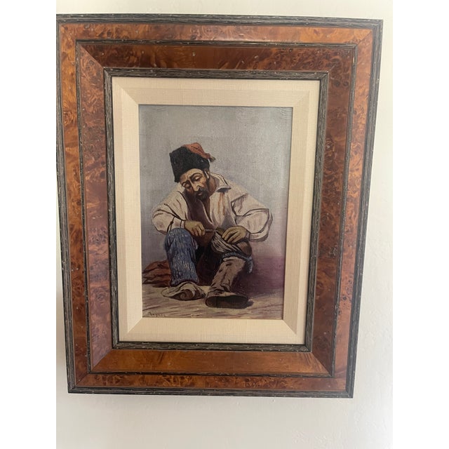 This striking artwork depicts a seated Turkish cobbler (köşker) focused intently on his traditional craft. The scene...