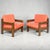 A pair of mid-century German oak lounge chairs, circa 1950s, featuring solid architectural frames and low, grounded...