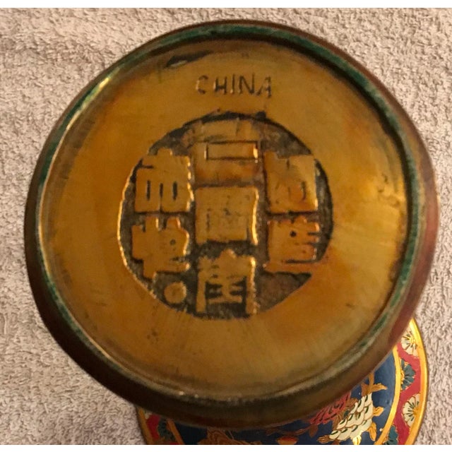 Enameled Brass vase Circa 1891-1919. Vase measures 10 1/4”H, base diameter is 3 1/4”. And opening is 6”. Vase is marked...