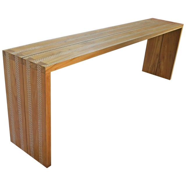 Minimalist waterfall teak wood console with Mother-of-Pearl shell inlay. Each piece of white shell is carefully hand cut...