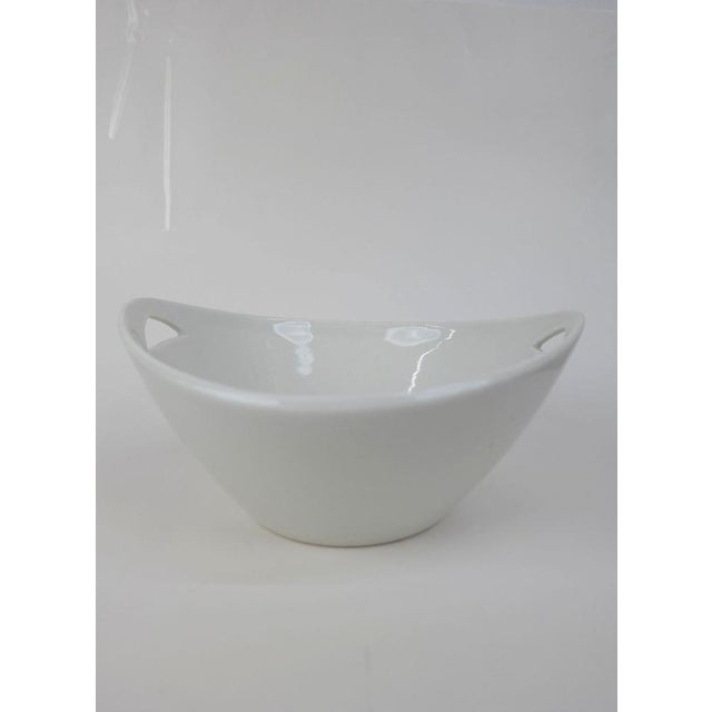 This elegant mid-century modern porcelain serving bowl was designed by the renowned Hungarian ceramicist János Török for...