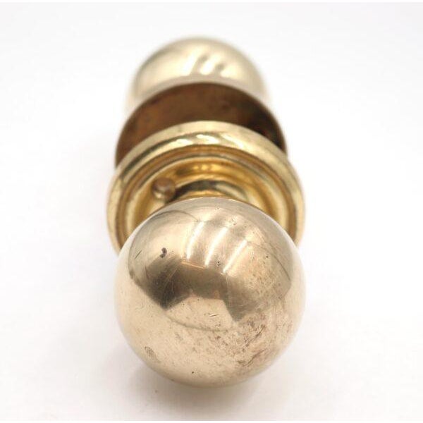 Newly made Modern ball shaped polished brass door knob set. The original mounting screws are not available. Priced as two...