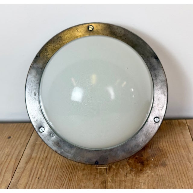 Vintage industrial emergency wall light made by Elektrosvit in former Czechoslovakia during the 1970s. It featutes a...