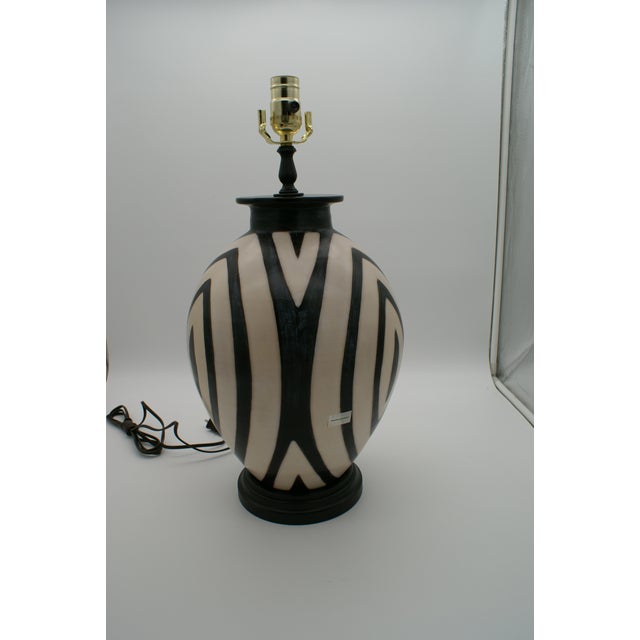 Add a touch of artisan elegance to your home with this stunning handcrafted lamp made from authentic Chulucanas pottery....