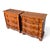 A pair of small three-drawer Italian chests. Each has a shaped serpentine front, burl walnut veneers, and brass teardrop...