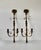 A dramatic pair of vintage French Regency-style pineapple and bow-tassel iron and carved wood wall candle sconces...