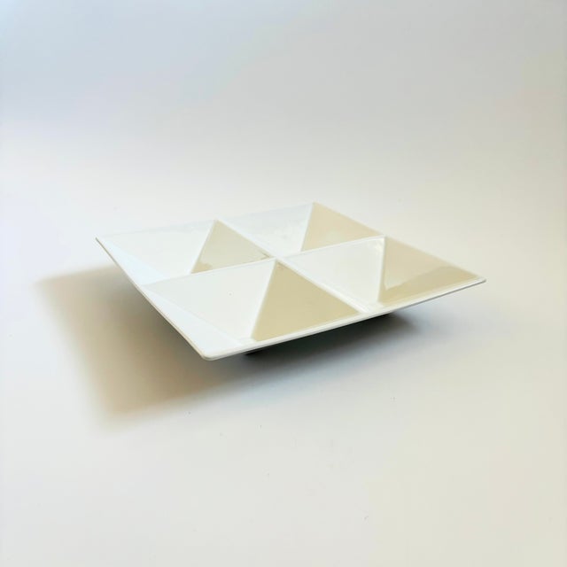 A mid century modern divided ceramic serving dish. From the "Origami" line designed by Kaj Franck for Arabia, Finland....