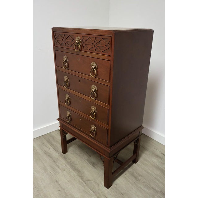 Vintage Baker Furniture Historic Charleston Collection mahogany tall chest, circa 1980s, featuring five drawers, pierced...