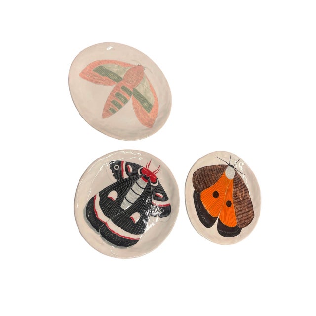 Enhance your wall decor or artisanal collection with this captivating set of three vintage studio pottery decorative...