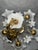 Elegant five-arm chandelier featuring with decorative floral milk glass shades. There is one very small chip on one of the...