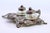 Silver Relief Inkwell with Glass Tanks, Floral Motifs and Cut-Out Feet, in Very Good conditions. Designed 1890 to 1919...