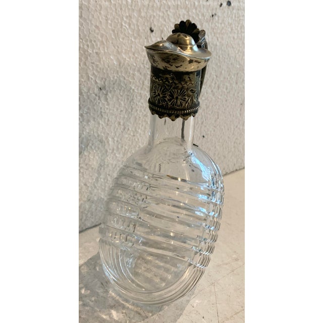 Beautiful carafe in cut glass or crystal (Crystal?) The handle and spout are silver-plated metal. Signs of wear, see...
