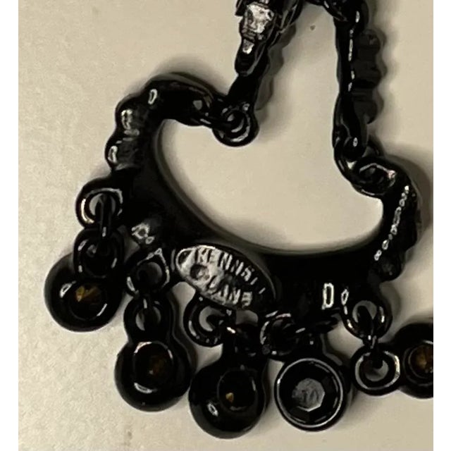 This is part of Chairish’s Costume Jewelry assortment. Kenneth Lane Hinge-back long dangle earrings in black lacquer and...