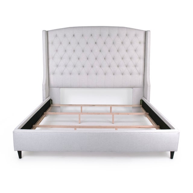 The Wingback Tufted Bed from Zentique is a made-to-order upholstered bed with a tufted wingback headboard in Hailey Bone...