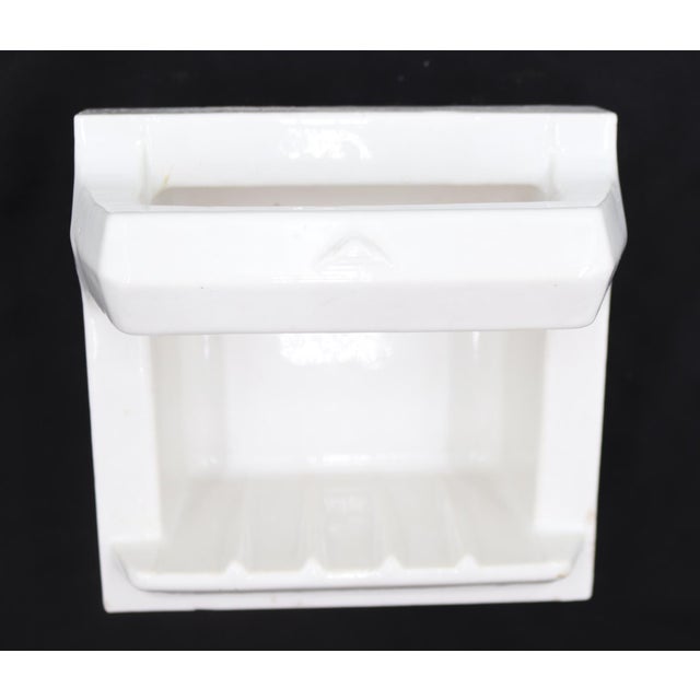 Flush mount square bathroom soap dish made of white porcelain over ceramic with a handle. Made by Fairfacts Co. Inc. Good...
