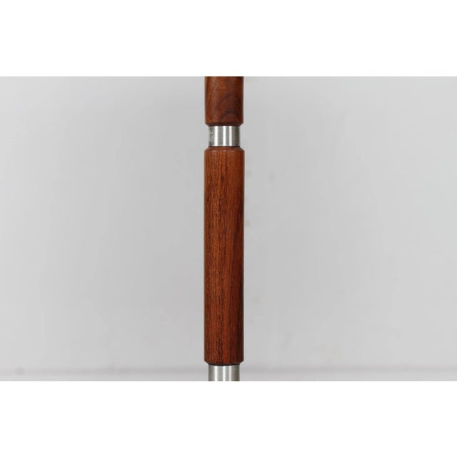 Mid-century adjustable Danish floor lamp in Jo Hammerborg style. The floor lamp is made of rosewood and brushed steel...