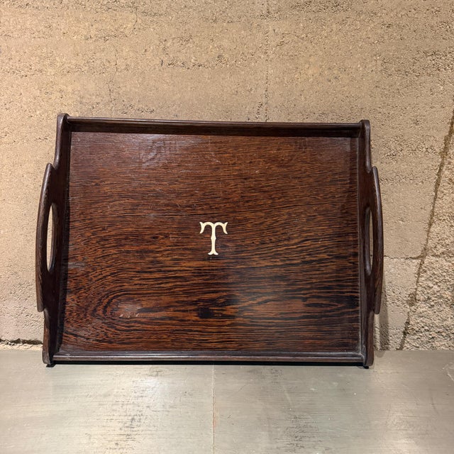 For your consideration, an art deco style antique service tray made of dark exotic wood from the early 20th century. It is...