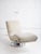 Mid-century chaise lounge rocker in textured cream upholstery on a chrome rocking swivel base. Designed by Milo Baughman...