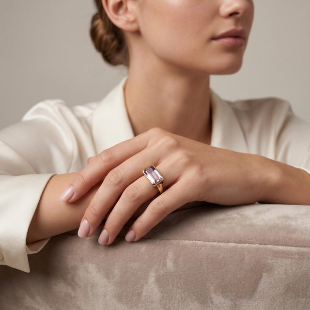 Elevate your style with this exquisite 18k Yellow Gold Signet Ring, featuring a stunning 3.30-carat pink tourmaline that...