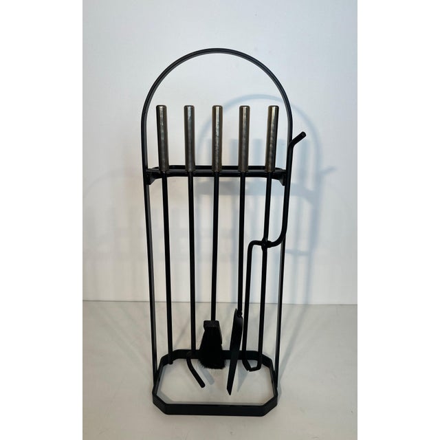 This beautiful design of free-standing fireplace tools is made of black lacquered metal and chrome. This piece can be...