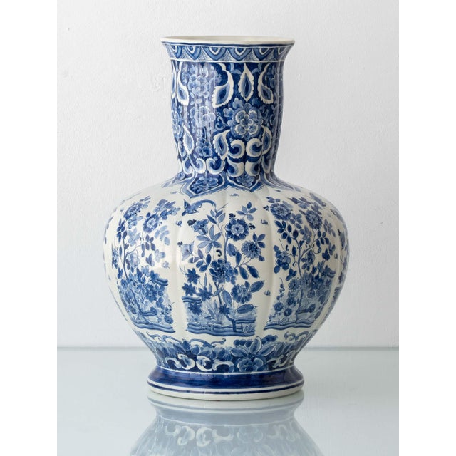 Dutch delft blue and white hand-painted chinoiserie floor vase by plateelbakkerij ram, arnhem — the ribbed body painted...