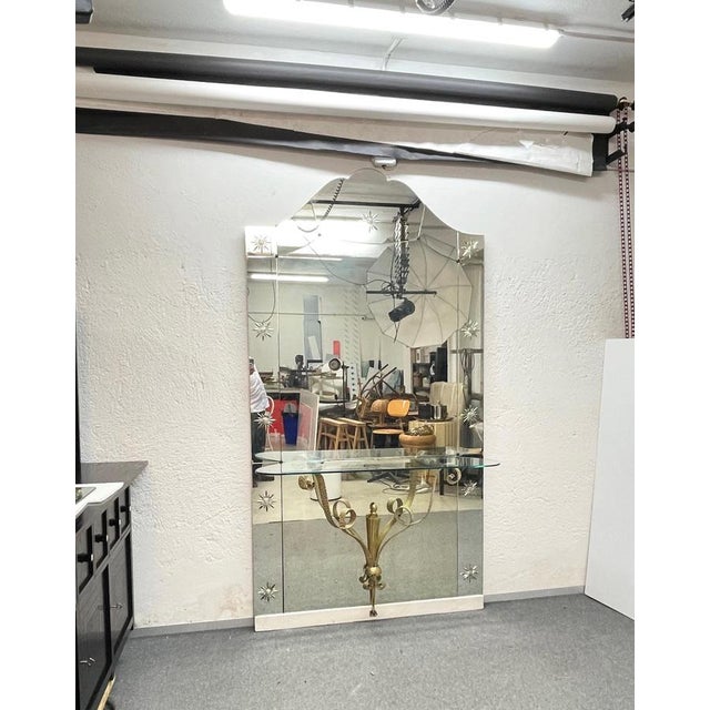 Fantastic Italian Mid-Century engraved mirror with gilt metal and glass. This fantastic item was designed by Pier Luigi...