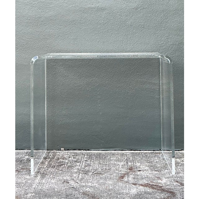 This elegant waterfall desk is a quintessential example of 1970s Hollywood Regency and Postmodern design. Crafted from a...