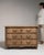 A cabinet whose dark iron skeleton key and escutcheon plate gives it real character at first glance. The piece dates to...
