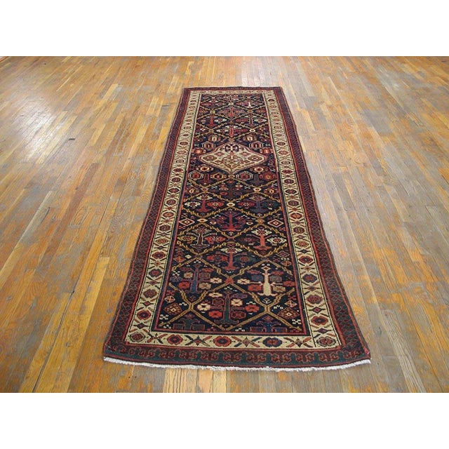Handmade antique NW Persian carpet. Woven, circa 1900. Runner size: 3'3" x 10'3". Central medallion with lattice. Design...