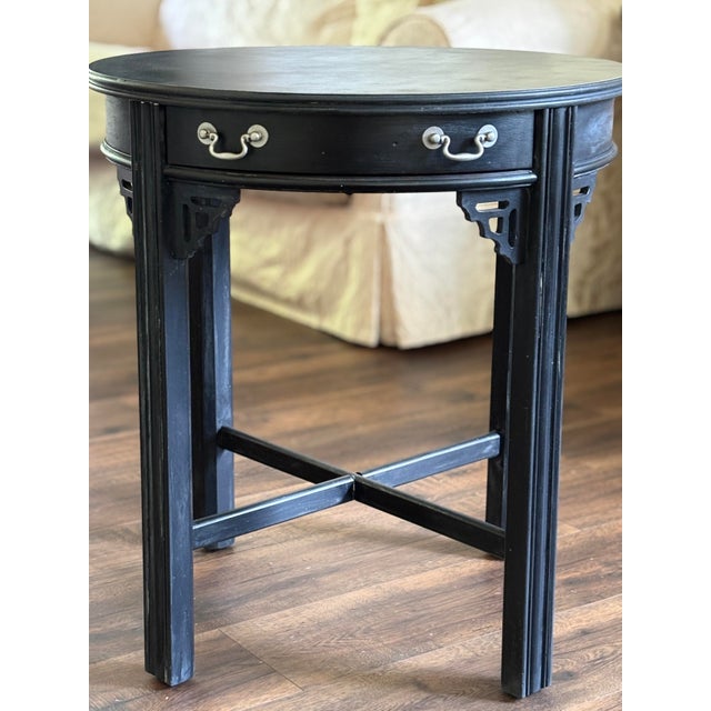 An exceptional antique round accent table showcasing a striking blend of classic Chinoiserie aesthetics and excellent...