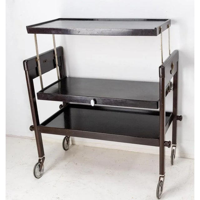 Rare and surprising, this three-tray table is transformable into a dining table. It is a well-known model: the geisha...