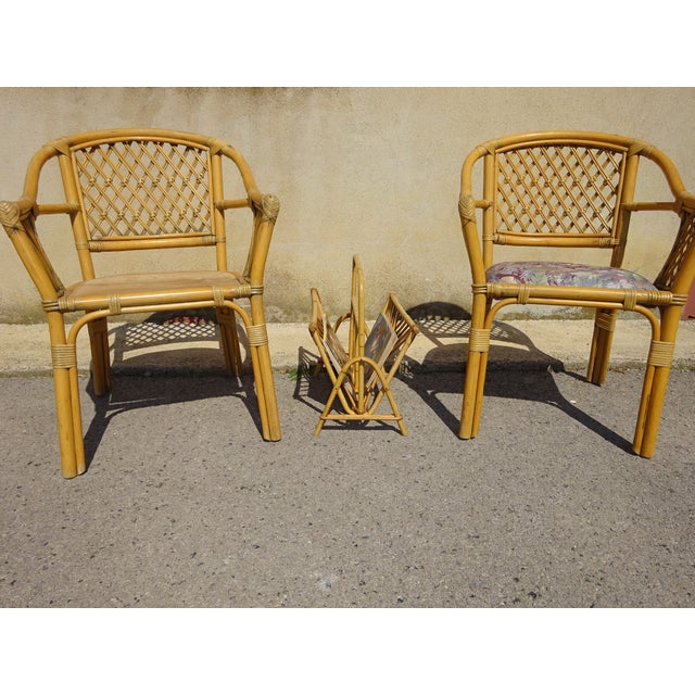 Rattan magazine rack with two storage compartments and a handle. The side is decorated with diamonds and is lightweight...