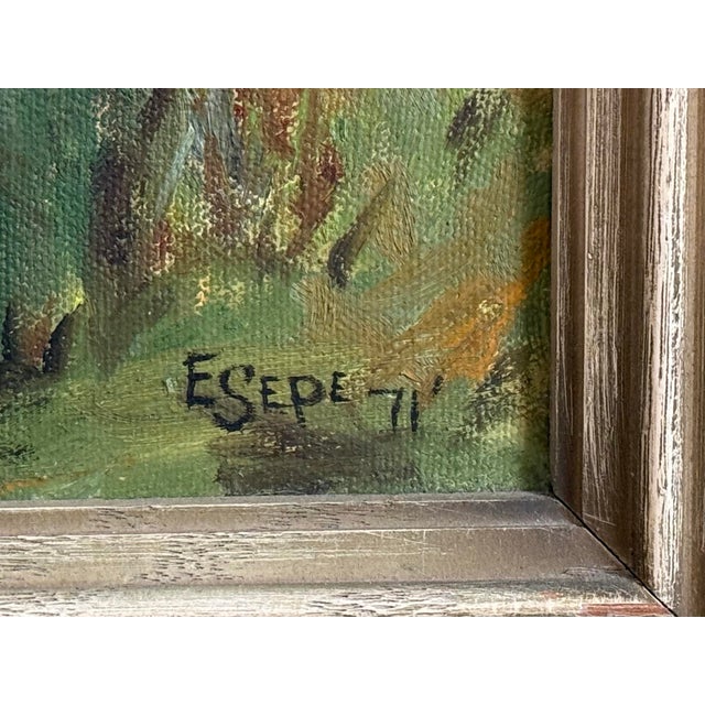 1970s framed Folk Art oil landscape painting of a beautiful stream through a land reserve surrounded by trees. In light...