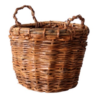 Vintage Handwoven Wicker Basket With Twisted Handles For Sale