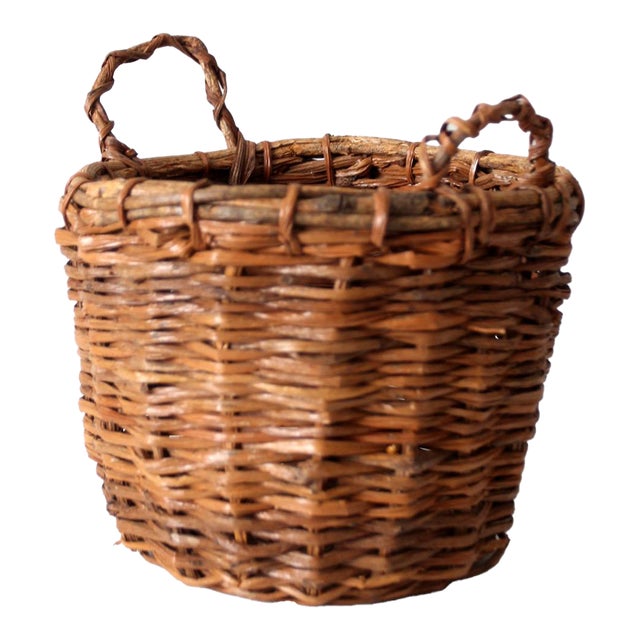 Vintage Handwoven Wicker Basket With Twisted Handles For Sale