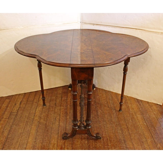 Circa 1840s turtle top Sutherland table, English. Highly figured walnut veneers & solids. The legs are fluted & beaded....