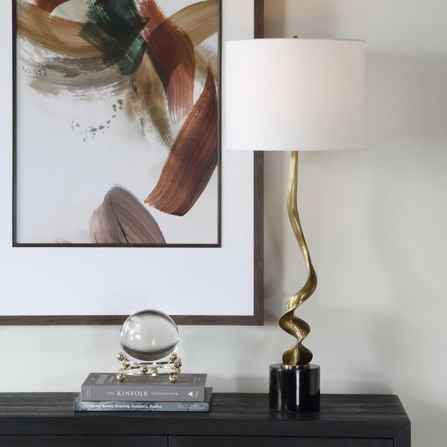 This Cordless Table Lamp Presents A Captivating Visual With Its Fluidly Twisting Metal Base In Antique Brass, Ascending...