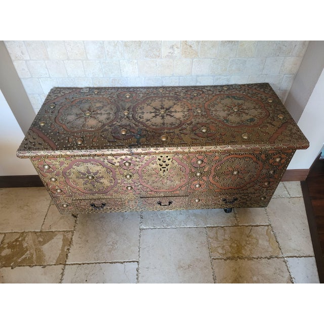 A richly detailed Zanzibar trade chest, showcasing the iconic East African–Arab craftsmanship that made these trunks...